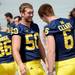 Michigan defensive end Tom Strobel jokes around with teammate quarterback Brian Cleary while outside the Junge Family Champions Center on Sunday, August 11, 2013. Melanie Maxwell | AnnArbor.com